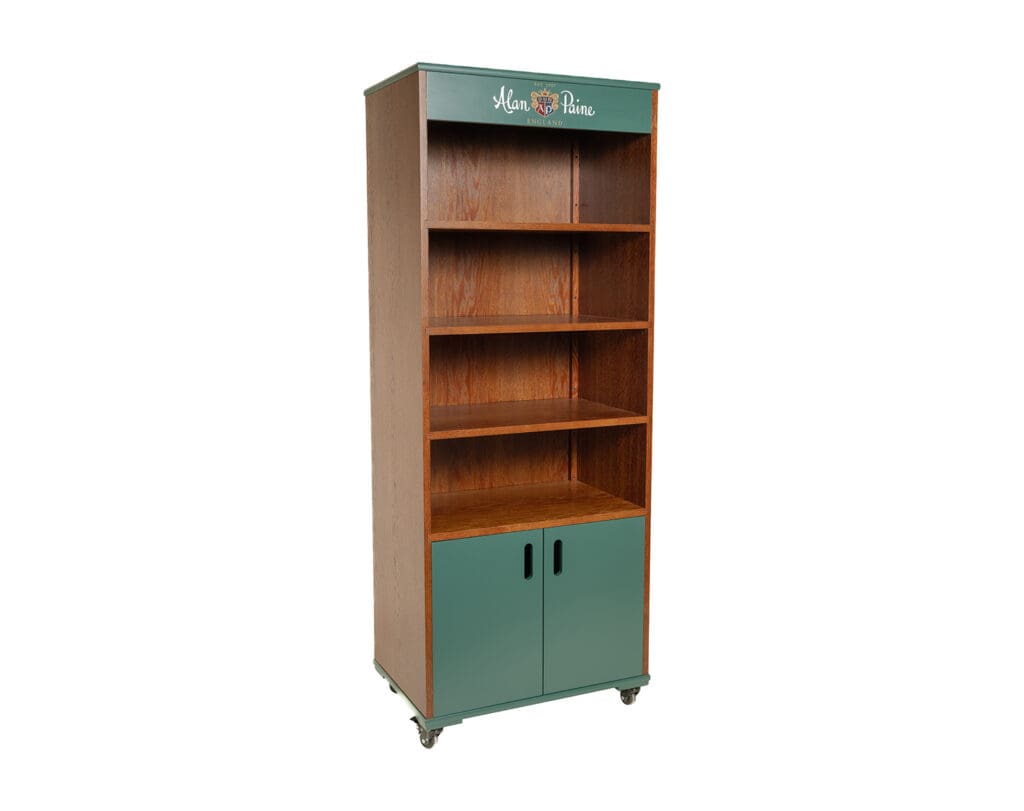 Front view of a bespoke oak veneer rolling point-of-sale display for Alan Paine England.