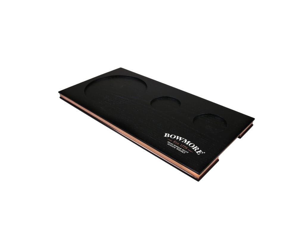 Bowmore whisky flight tray with black veneered top, three recessed positions and copper side detail.