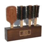 Wooden POS display block for The Bristle Brush Company with brush slots and laser-engraved paint-filled branding