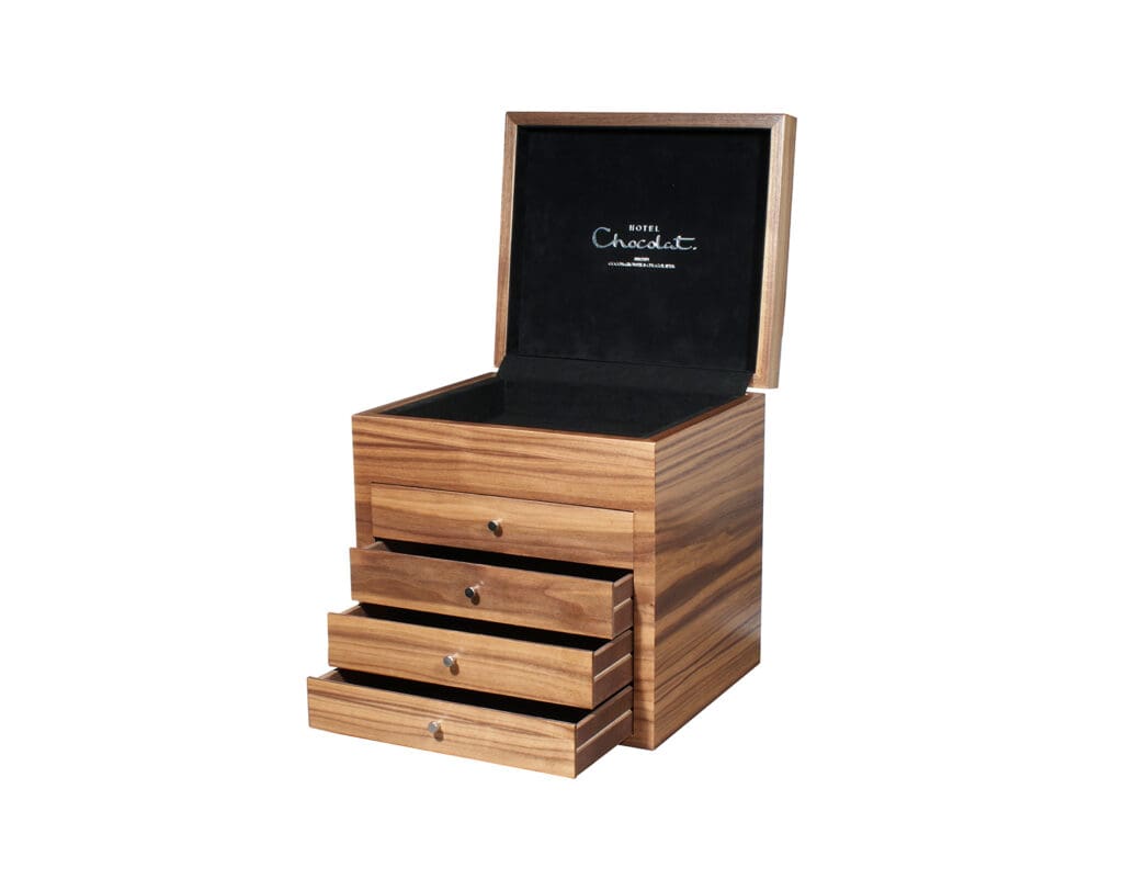 Open view of a Hotel Chocolat presentation box showing black velvet lining.