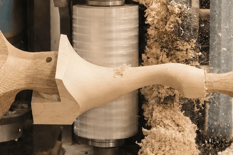 Close up of a CNC machine crafting something unique from wood